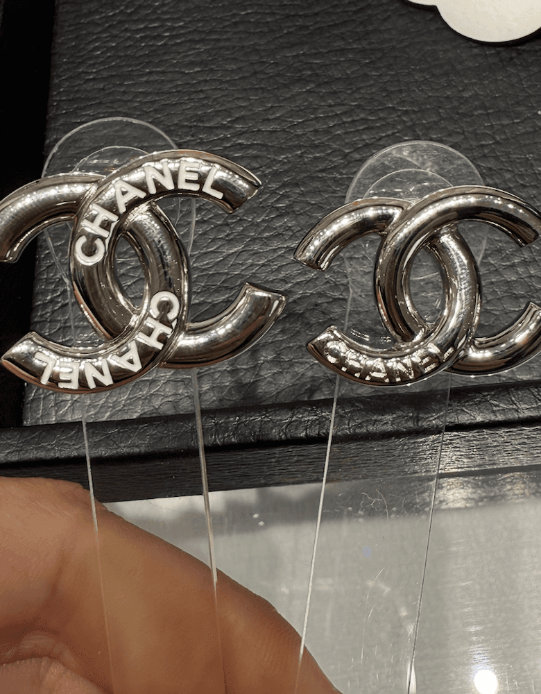 Chanel logo earrings, a piece of custom jewelry. They'd make a great statement earring.