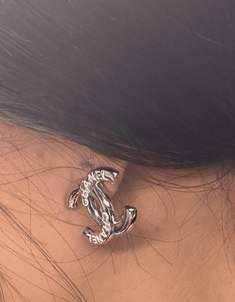 Chanel logo earrings, a piece of custom jewelry. They'd make a great statement earring.