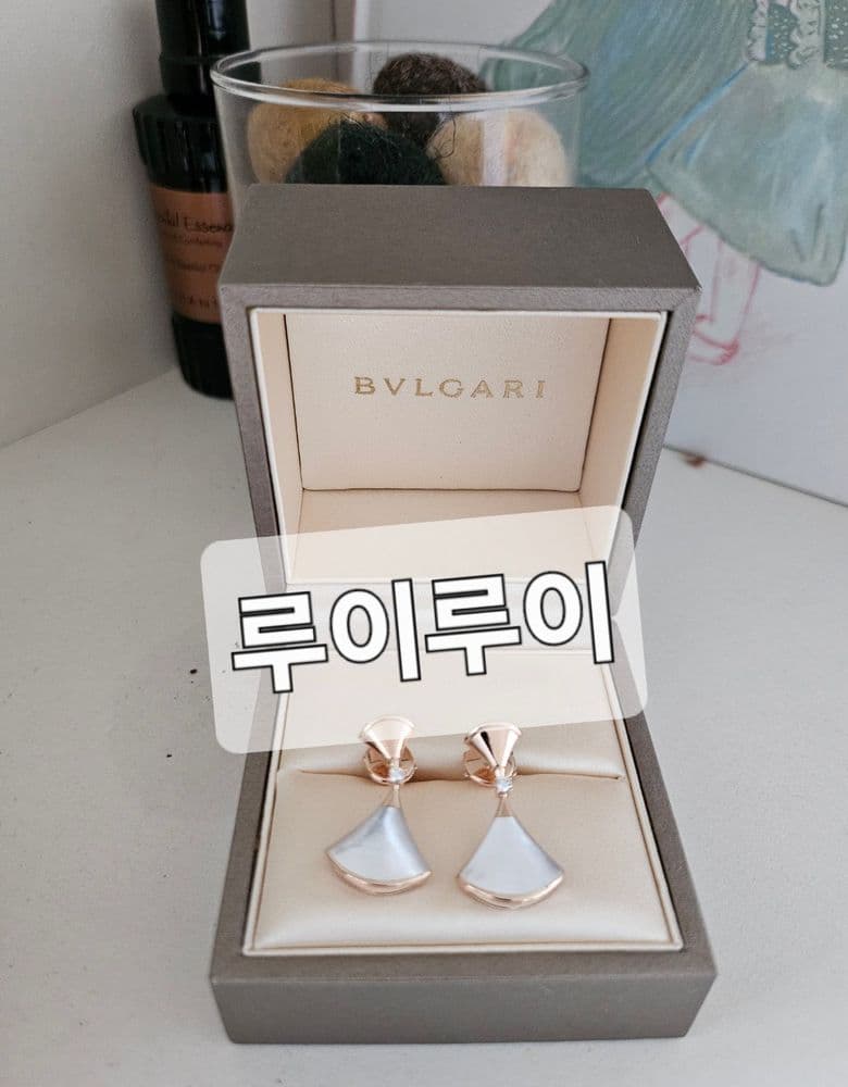 Bulgari Divas' Dream Earrings with a milky, opalescent mother-of-pearl.
