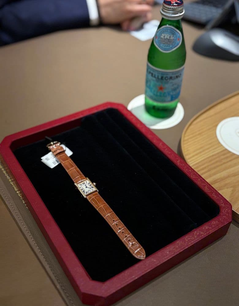 Cartier Tank Louis with a brown strap.