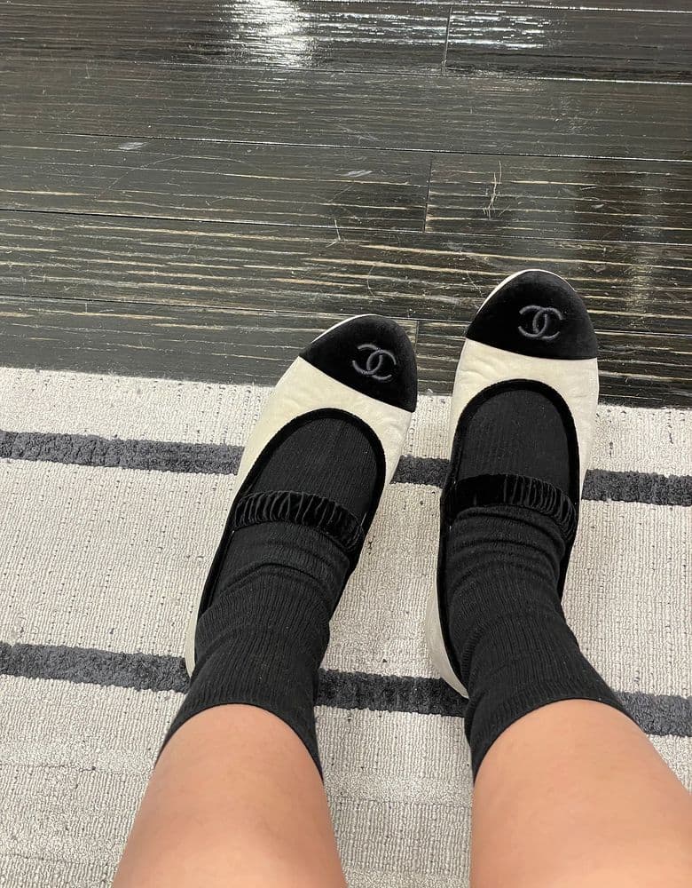 Chanel 25A Velvet Mary Janes in classic black and beige.