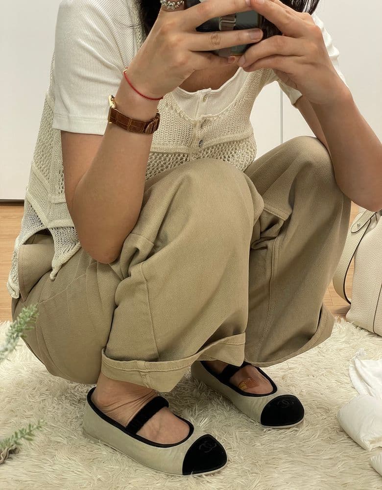 Chanel 25A Velvet Mary Janes in classic black and beige.