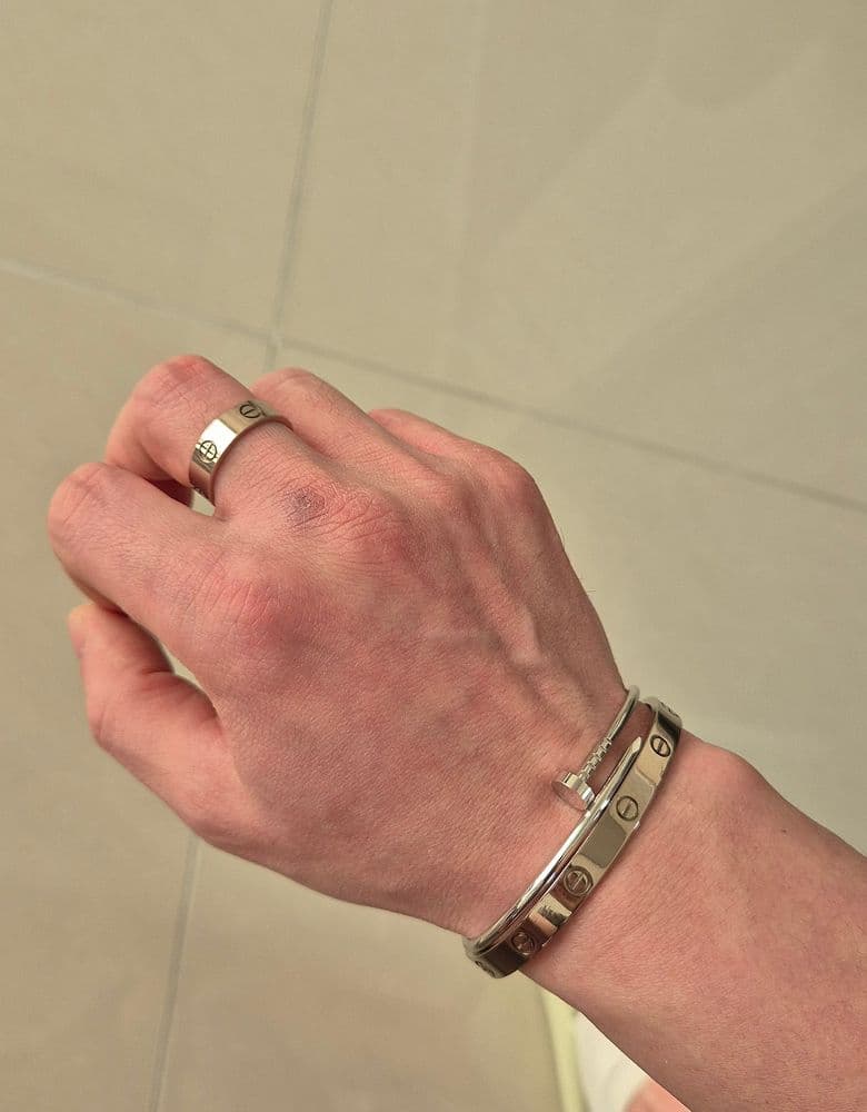 Cartier's must-have pieces: the LOVE bracelet and the Ecrou bracelet.