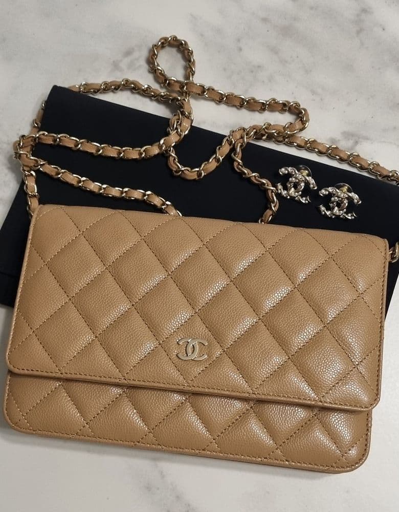 Chanel WOC (Wallet On Chain) in light beige, classic caviar leather.