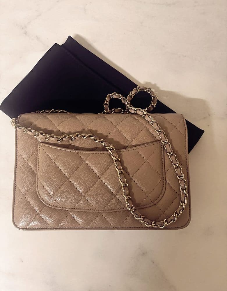 Chanel WOC (Wallet On Chain) in light beige, classic caviar leather.
