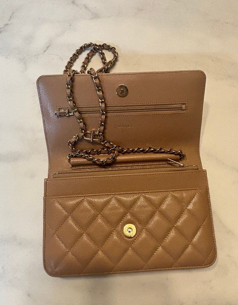 Chanel WOC (Wallet On Chain) in light beige, classic caviar leather.