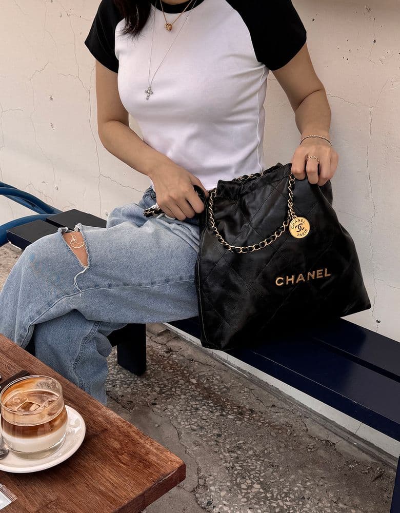 Looking for a Chanel Classic Flap Bag in white, perhaps a 22 Bag (large size), a vintage flap bag, or a Coco Handle in small.