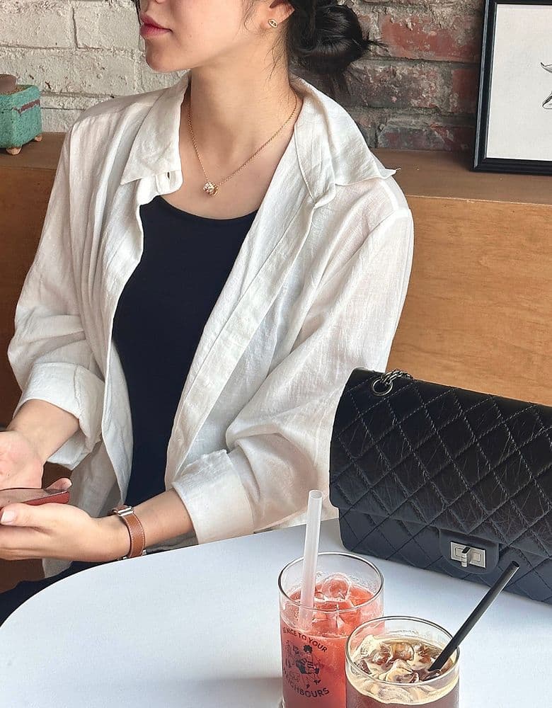 Looking for a Chanel Classic Flap Bag in white, perhaps a 22 Bag (large size), a vintage flap bag, or a Coco Handle in small.