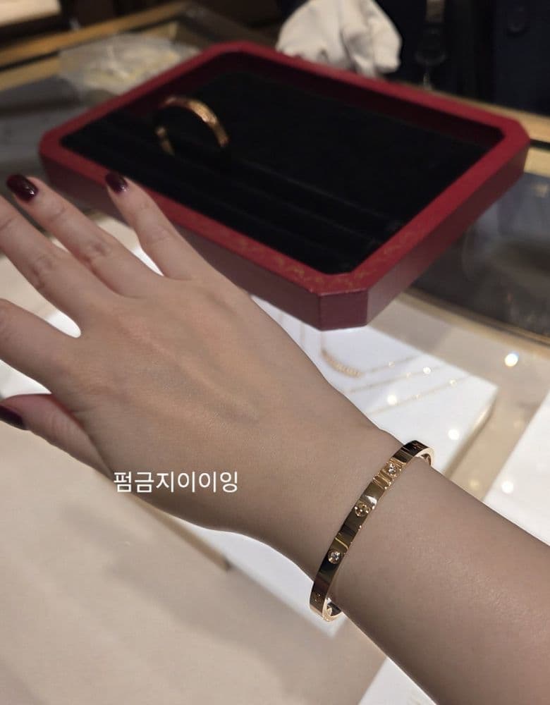 Cartier's new Love bracelet in pink gold, medium size with 4 diamonds.