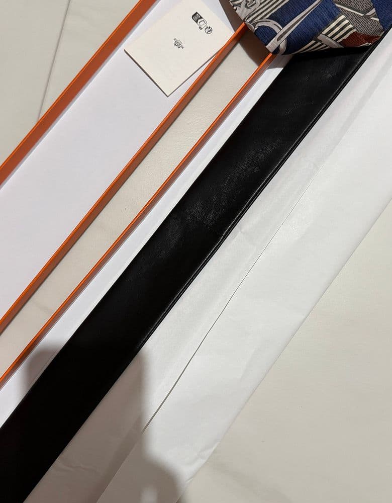 Hermès Twilly scarf in a longer, leather version.