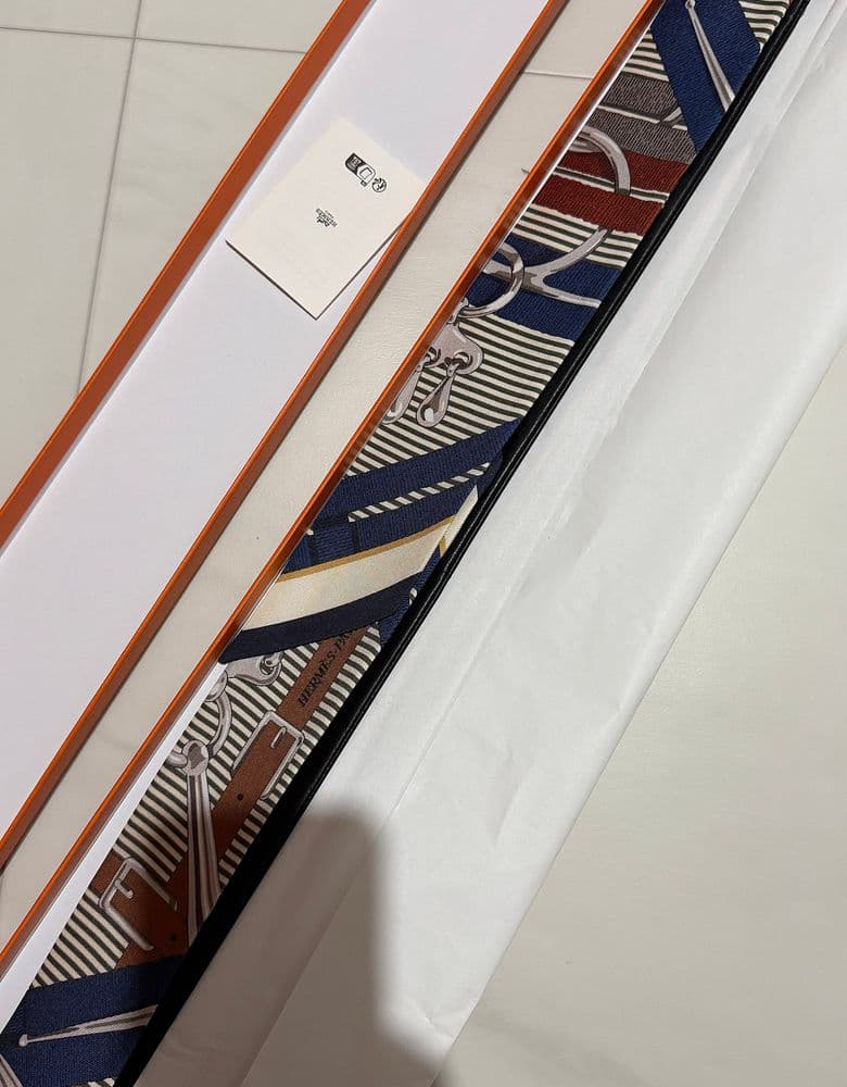 Hermès Twilly scarf in a longer, leather version.