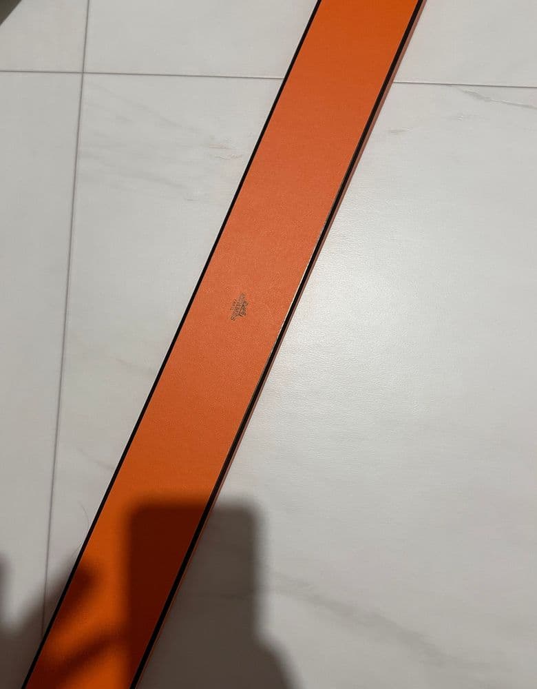 Hermès Twilly scarf in a longer, leather version.