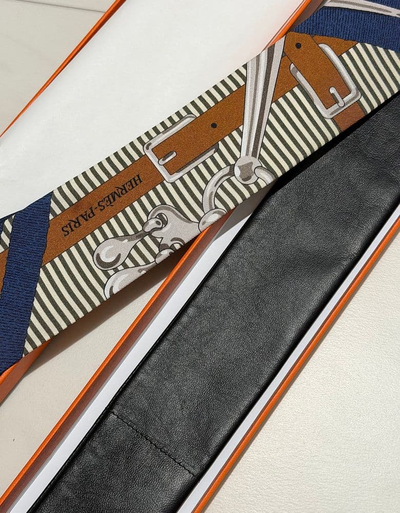 Hermès Twilly scarf in a longer, leather version.