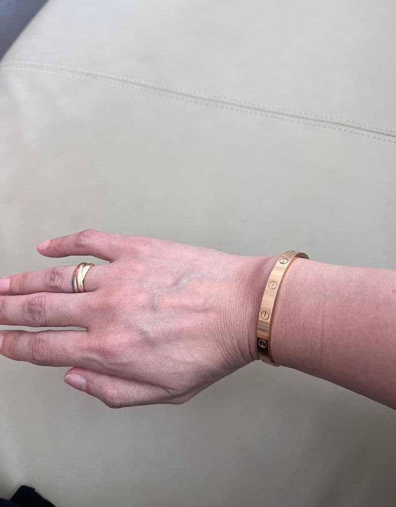 Cartier Love Bracelet and Trinity Ring.