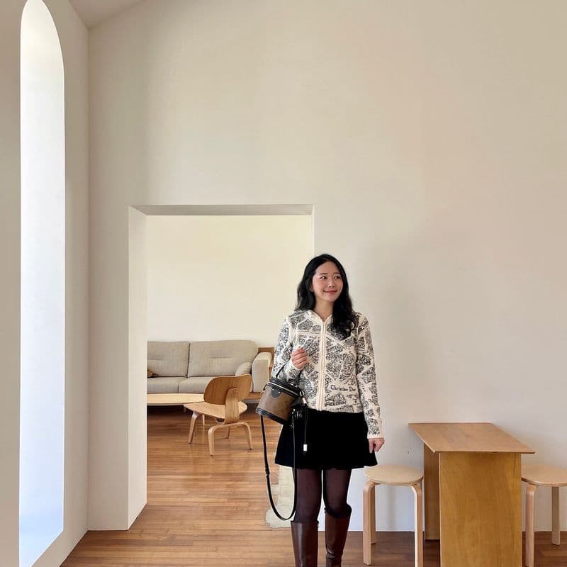 Dior knit zip-up, Louis Vuitton Cannes bag, and Miu Miu headband: A perfect everyday look for that in-between season from winter to spring.