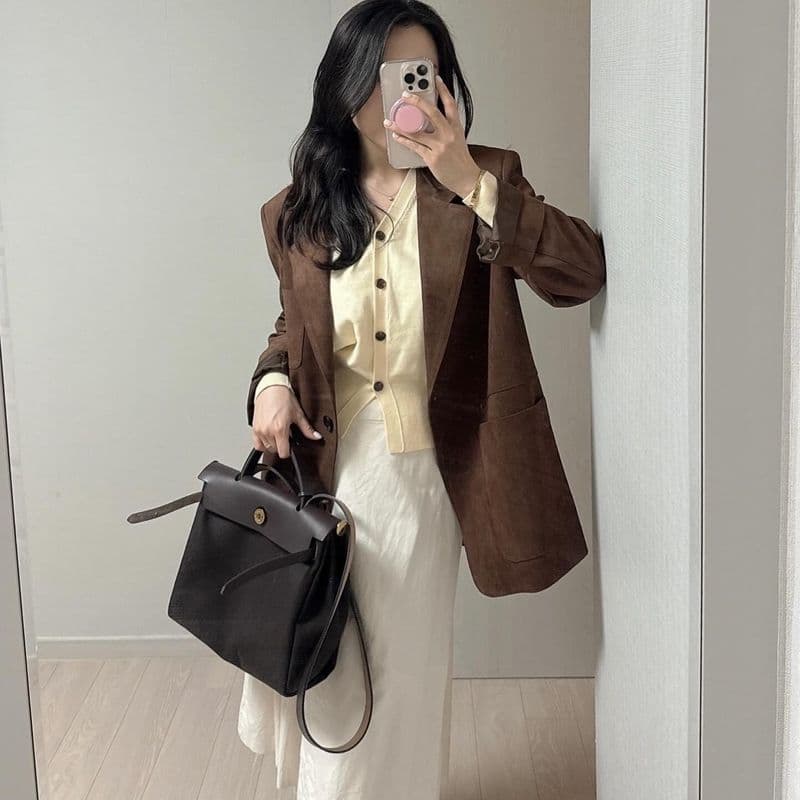 Spring looks styled with a variety of bags, including the Hermès Bolide, Hermès Herbag, and Chanel Classic Flap bag.