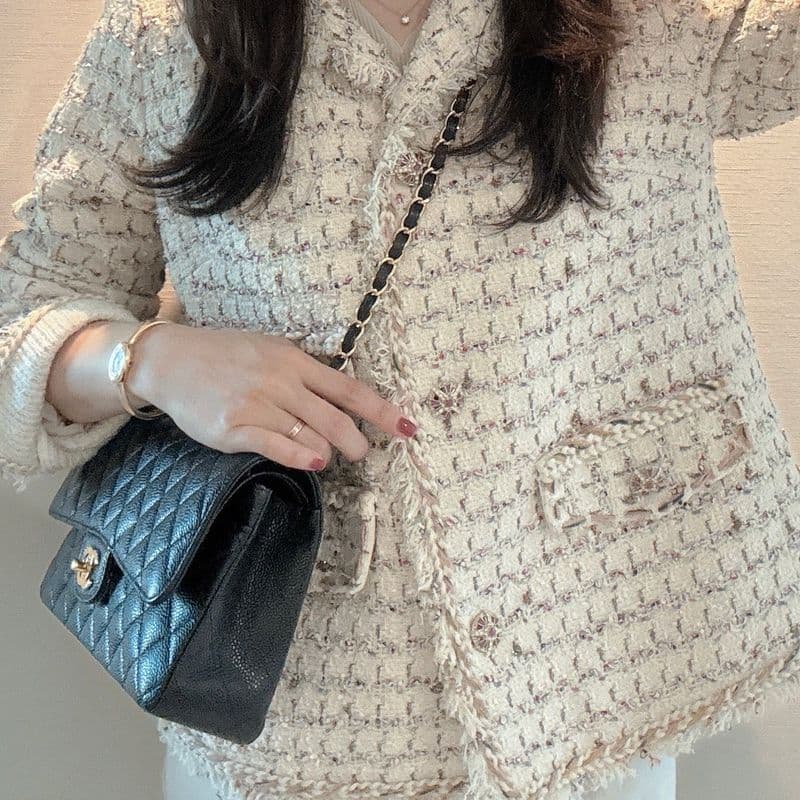 Kuku's curated outfits featuring the Chanel Classic Medium with gold hardware and Cartier Baignoire bangle.