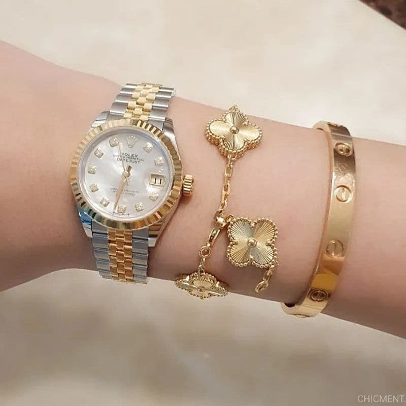 What's the most beautiful pairing with a Cartier Love bracelet? A layered combination of a Candy Kelly, Rose des vents, and a tennis bracelet.