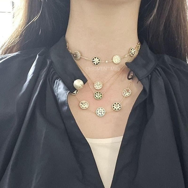 How to create a high jewelry look with layered Dior Rose des Vents bracelets and necklaces.