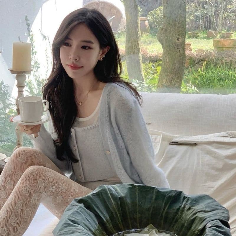 Sharing my Jeju travel outfit! I styled a Chanel cardigan with Chanel stockings.